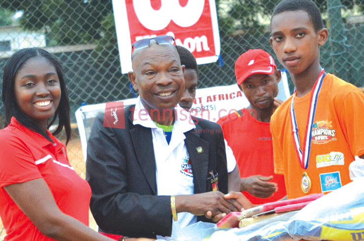 Georgina Nketiah Osei of SIC Life and Mr Saka Acquaye of the NSA presenting prizes to Aaron Apau, last year’s winner of the U-14 category